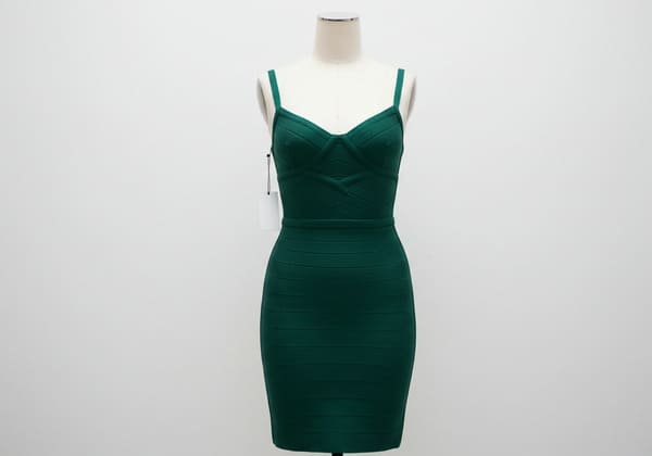 A stylish bandage dress on a mannequin with a price tag