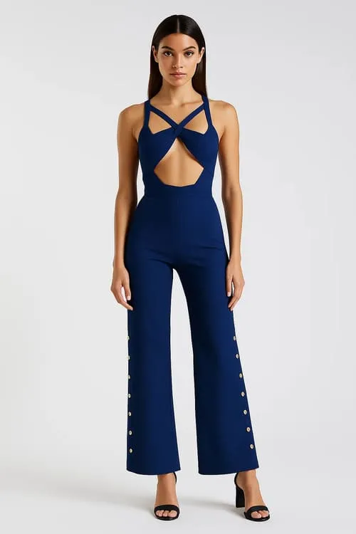 A model in a navy bandage jumpsuit with crossstraps